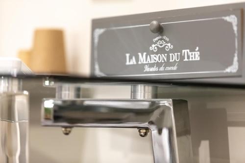 a sign for a mason do kitchen on a shelf at Suites 44 - Guesthouse close to Vaticano, San Pietro, Castel Sant'angelo in Rome