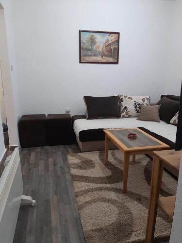 a living room with a couch and a coffee table at Vikendica RTANJ in Rtanj