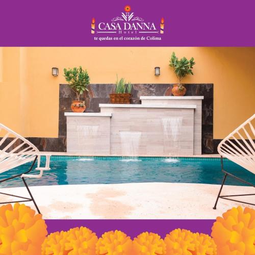 a swimming pool with two chairs and a kitchen at Hotel Casa Danna in Colima
