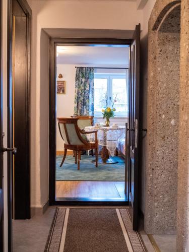 a door leading into a dining room with a table at Katzerhaus Ebensee in Ebensee