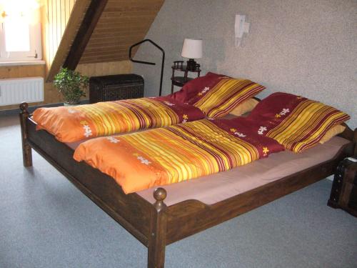 Cama o camas de una habitación en Ferienwohnungen im Fachwerkhaus
