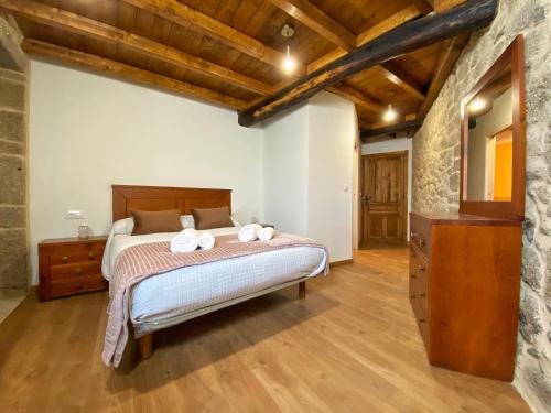 Un pat sau paturi într-o cameră la Casa do Veiga