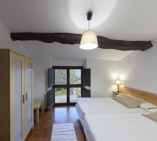 Postel nebo postele na pokoji v ubytování Casa de Aldea Casina del Naranjo