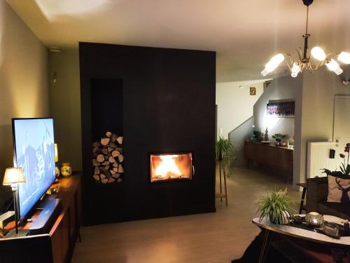a living room with a fire place in the wall at fredhousedurbuy in Durbuy