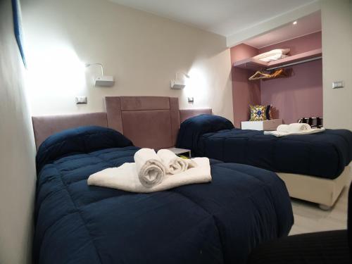 Ένα ή περισσότερα κρεβάτια σε δωμάτιο στο Stella-Guesthouse - Terrazzo privato e relax vicino Siracusa