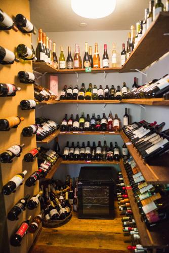 a room filled with lots of bottles of wine at Pousada Boutique Itaipava in Itaipava
