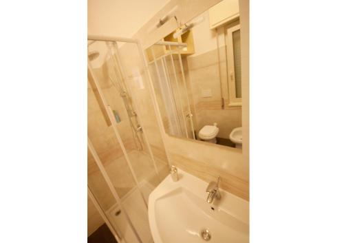 a bathroom with a shower and a toilet and a sink at Sophie's Choice in Rome