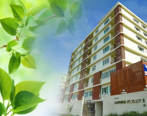 a rendering of a building with green leaves at Charming Resident near BTS Ekkamai Station in Bangkok