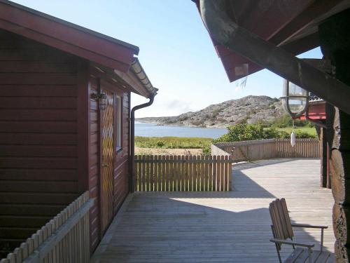 a porch of a house with a view of the ocean at 9 person holiday home in H LLEVIKSSTRAND in Hälleviksstrand