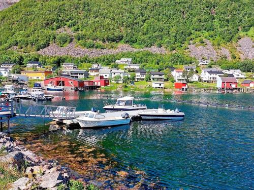 a group of boats docked in a body of water at 10 person holiday home in Kaldfarnes in Sifjord