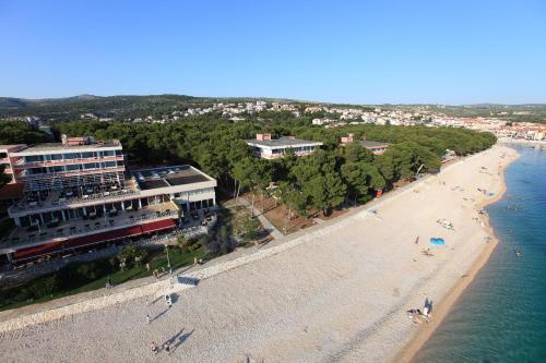 an aerial view of a beach with a train at Hotel Zora in Primošten