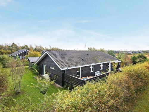 an aerial view of a house in a field at 6 person holiday home in Tarm in Hemmet