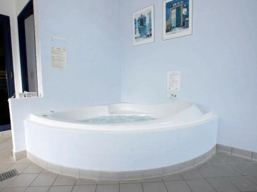 a large white bath tub in a room at 10 person holiday home in Hadsund-By Traum in Nørre Hurup