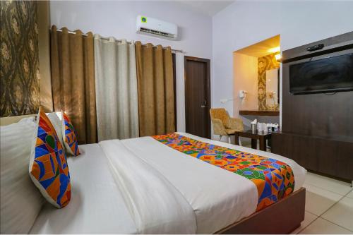 Ένα ή περισσότερα κρεβάτια σε δωμάτιο στο FabHotel K9