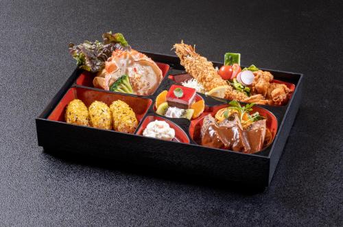 a black box filled with different types of food at Nakatsugawa Onsen Hotel Hanasarasa in Ochiai