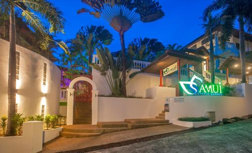 a house with a sign in front of it at Samui Little Garden Resort in Chaweng
