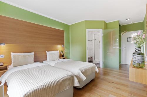 Ένα ή περισσότερα κρεβάτια σε δωμάτιο στο Hotel Rosengarten