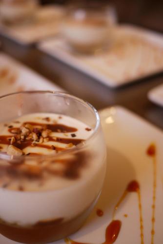 a cup of coffee on a plate on a table at Arcanson in Méaudre