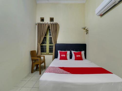 Ένα ή περισσότερα κρεβάτια σε δωμάτιο στο OYO 90892 My Guest House Syariah