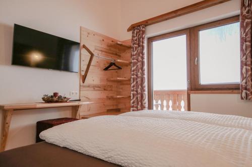 Ένα ή περισσότερα κρεβάτια σε δωμάτιο στο Bamerhof Haus Steger