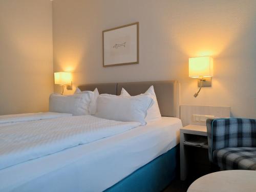 En eller flere senge i et værelse på Hotel Braunschweiger Hof