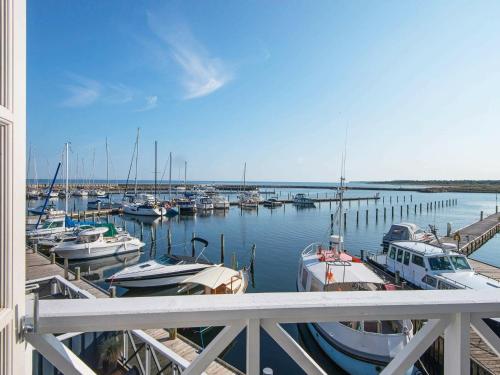 a group of boats docked at a marina at 6 person holiday home in Grenaa in Grenå