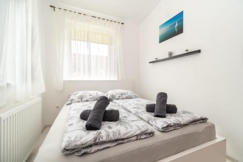 Postel nebo postele na pokoji v ubytování Grand 56 Apartman-Keszthely