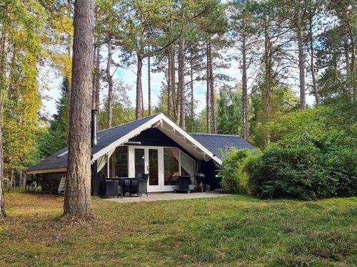 a small house in the middle of a forest at 7 person holiday home in Store Fuglede in Store Fuglede