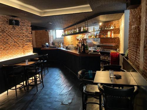 a bar with tables and chairs in a restaurant at Safestay Madrid Central in Madrid