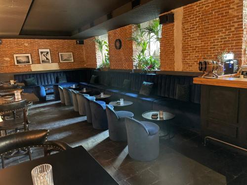 a restaurant with a row of tables and chairs at Safestay Madrid Central in Madrid