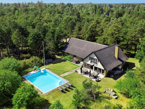 an aerial view of a house with a swimming pool at 14 person holiday home in Sj llands Odde in Tjørneholm