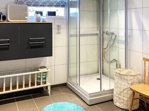 a shower with a glass door in a bathroom at Seaside Retreat in Lyngen-By Traum in Svensby