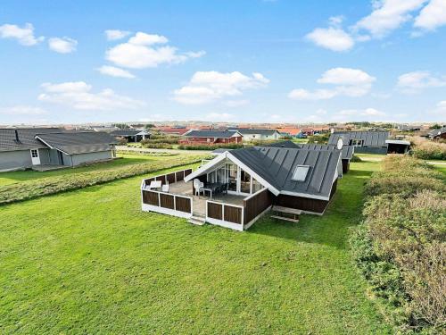 an overhead view of a house in a field at 8 person holiday home in Harbo re in Harboør