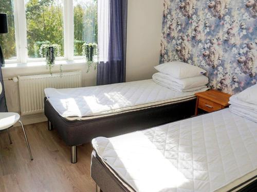 Postel nebo postele na pokoji v ubytování Holiday home LJUNG
