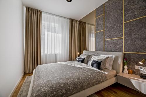 Voodi või voodid majutusasutuse Bucharest Luxury Apartments toas