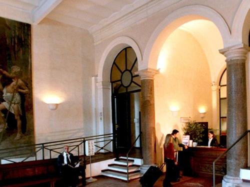 a group of people standing in a building at Domus Sessoriana in Rome
