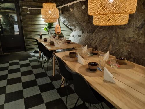 a row of tables in a restaurant with a checkered floor at Charming 1-Bed Apartment in Lulea in Luleå