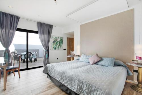 Ένα ή περισσότερα κρεβάτια σε δωμάτιο στο Villa Dolce Vita Tenerife Sur
