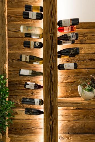 a wall of wine bottles in a wine cellar at Alpin Hotel Gudrun in Colle Isarco