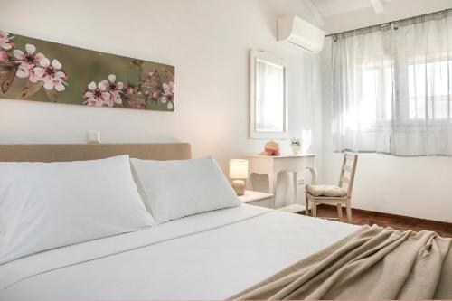 Postel nebo postele na pokoji v ubytování Apollonides Seafront Villa1 Aoede