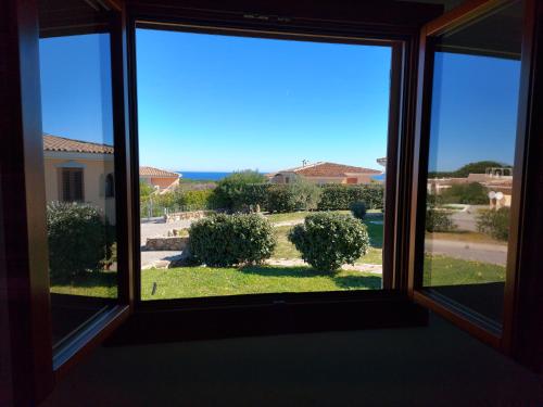 a view from a window of a yard at Gallura Dream villas in Budoni