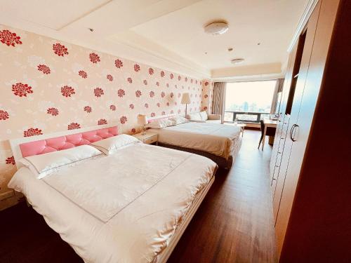 En eller flere senge i et værelse på 台中自由行