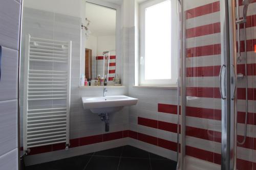 a bathroom with a sink and a window at Solemare in Tortoreto Lido