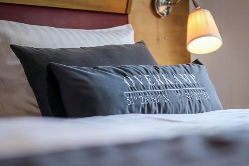 Una cama o camas en una habitación de Overkamp