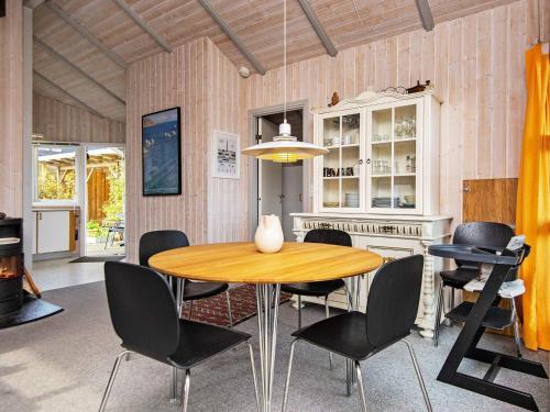 a dining room with a table and chairs at 6 person holiday home in Børkop-By Traum in Børkop