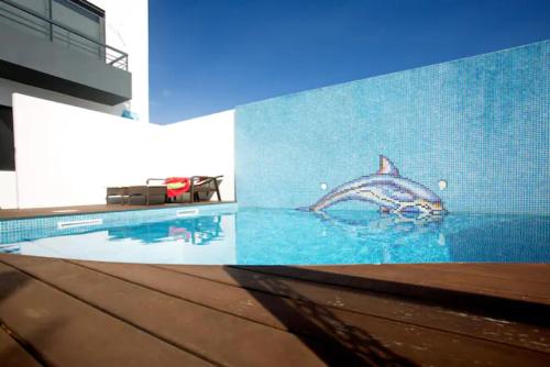 a mural of a shark on the side of a building at 2Stay - A1 in Ponta Delgada