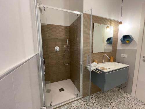 a bathroom with a shower and a sink at White Wall luxury rooms Scala dei turchi in Realmonte