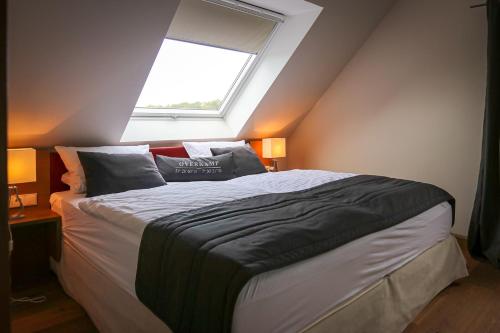 Una cama o camas en una habitación de Overkamp