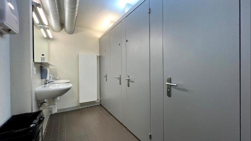 a bathroom with a sink and a toilet at Zermatt Youth Hostel in Zermatt