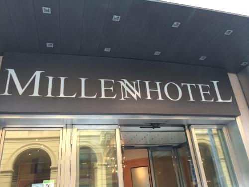 a hotel sign on the front of a building at Millennhotel in Bologna